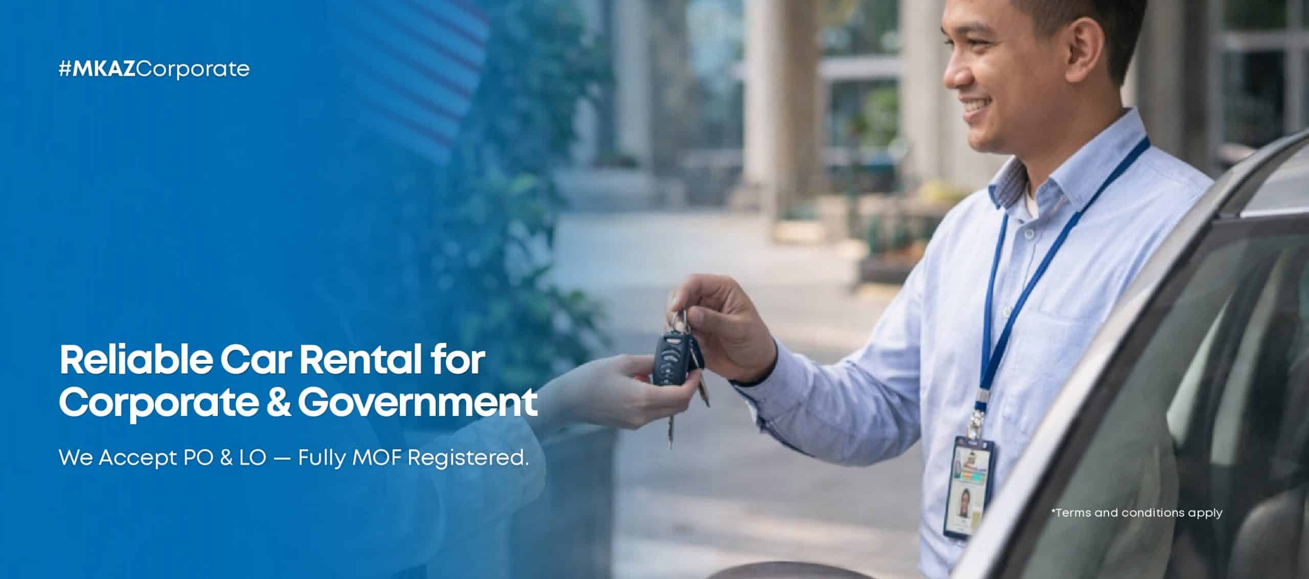 Employee hands car keys to a customer beside a car in front of a blue advertisement banner about corporate car rentals, smiling.