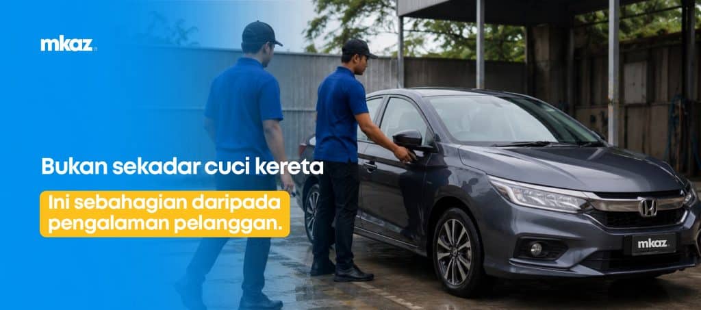Two workers in blue uniforms wash a gray Honda car beside a blue gradient banner with the mkaz logo.